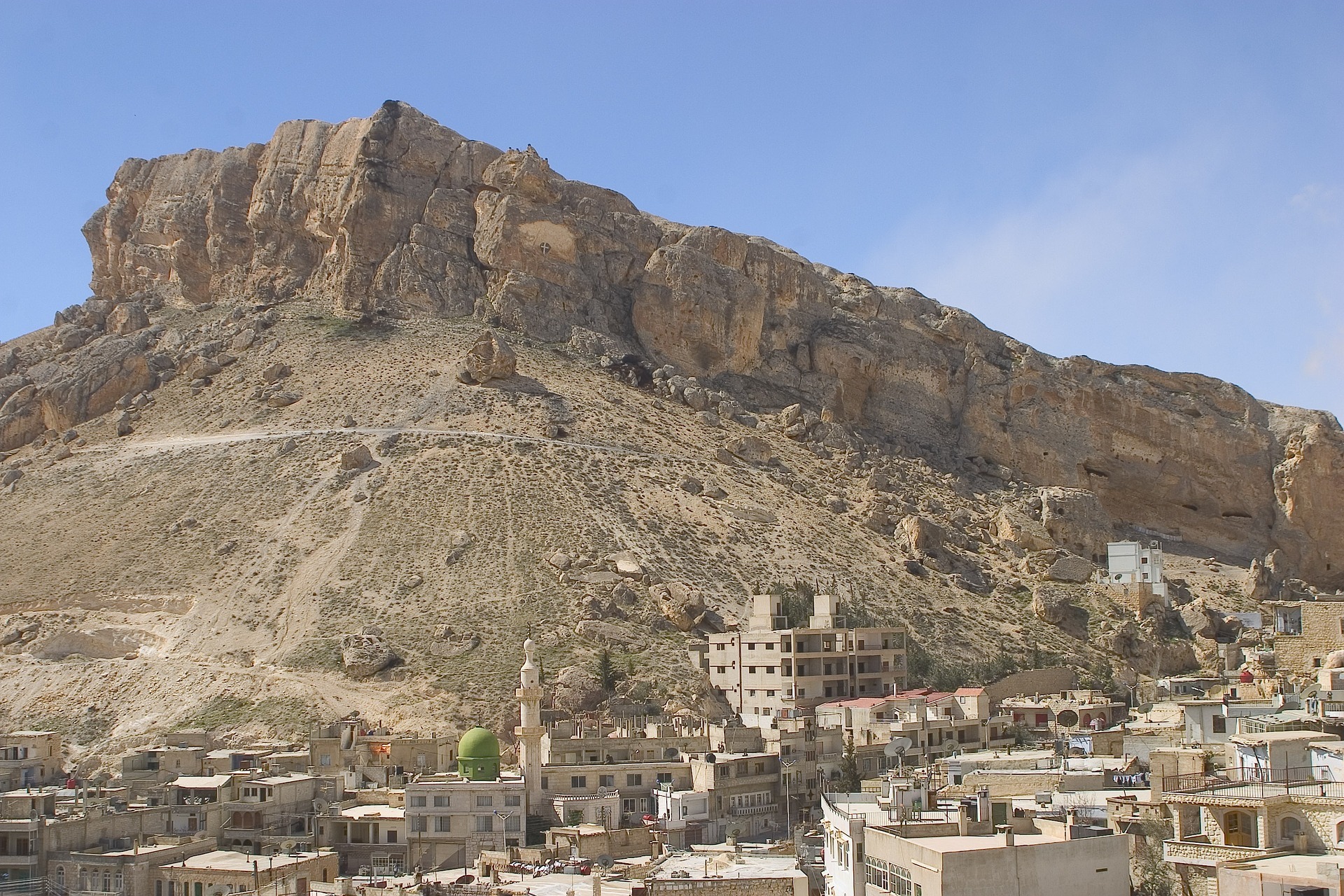 Why have persecuted Christians in Syria purchased a graveyard?